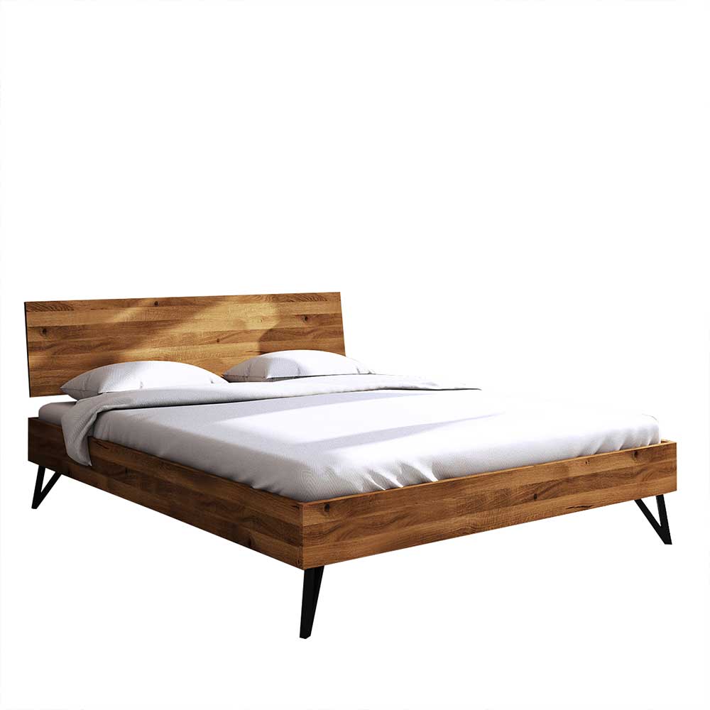 Holzbett Cariasca aus Wildeiche Massivholz und Stahl mit 20 cm Bodenfreiheit