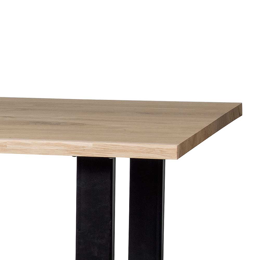 Baumkantentisch Dariofa mit Bügelgestell aus Metall und Eiche Massivholzplatte
