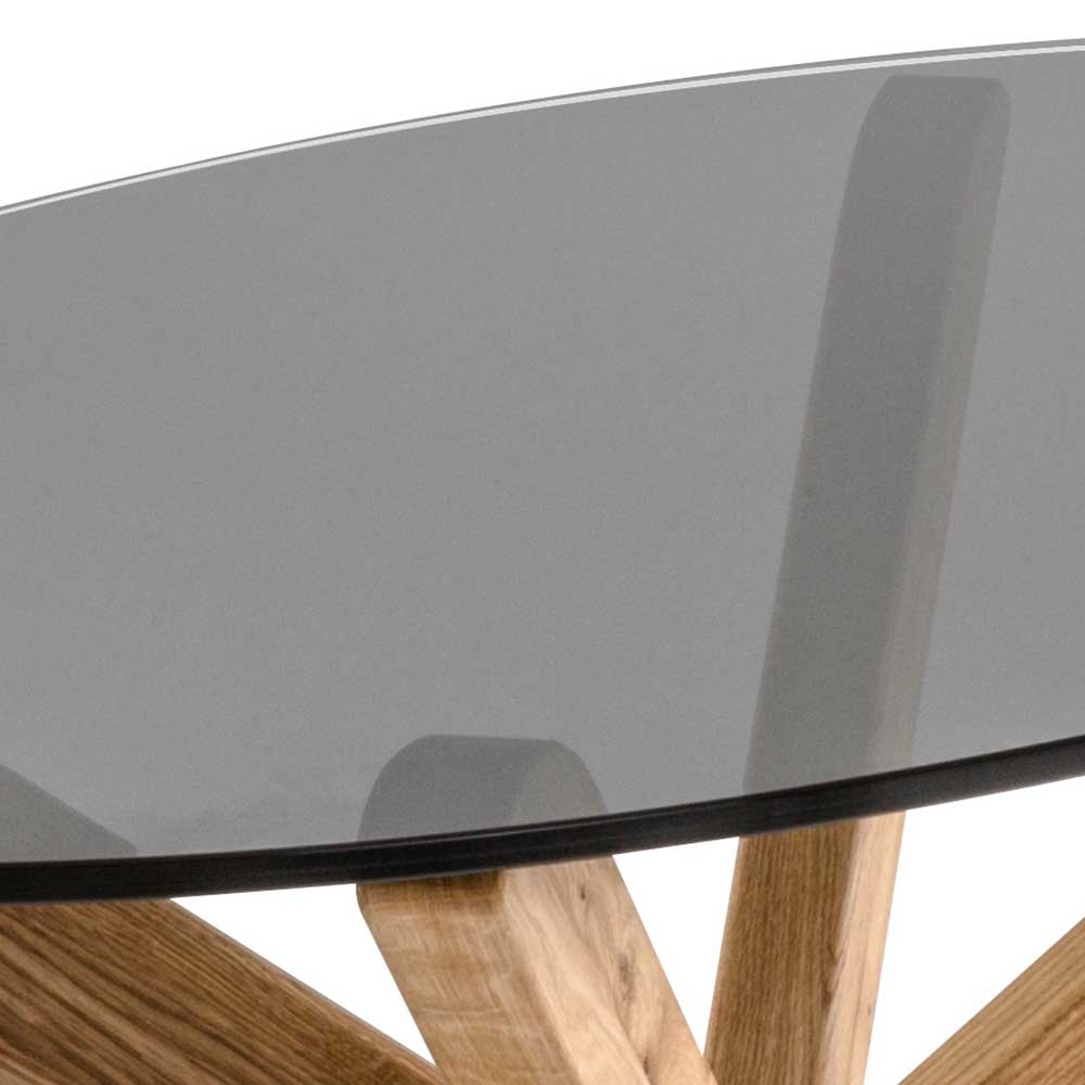 Design Couchtisch Vorenas aus Asteiche Massivholz mit ovaler Rauchglasplatte
