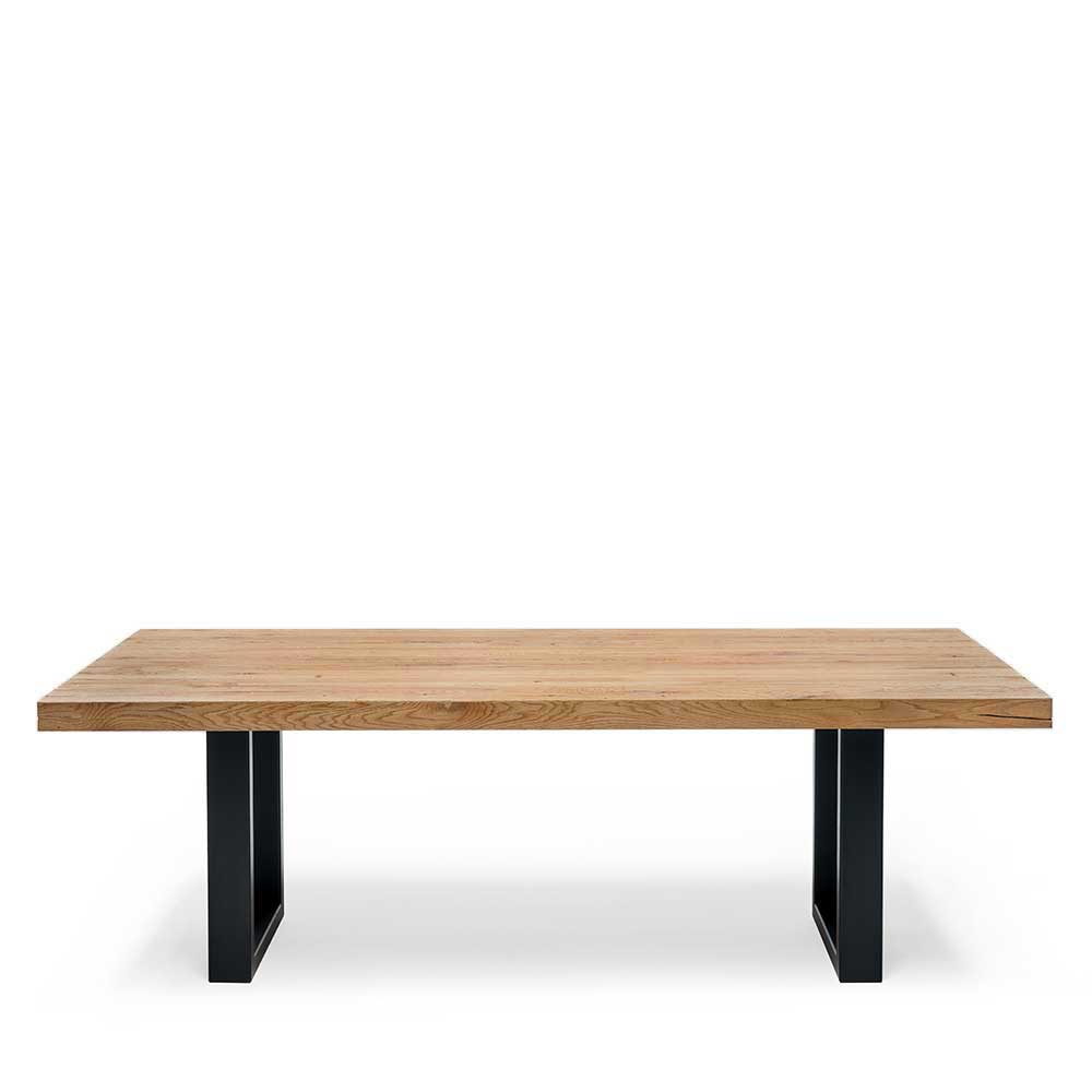 Tisch Seviona aus Wildeiche Massivholz geölt mit Bügelgestell aus Metall